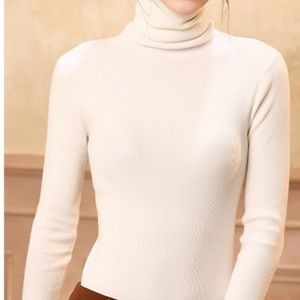 Creamy white knit turtleneck sweater